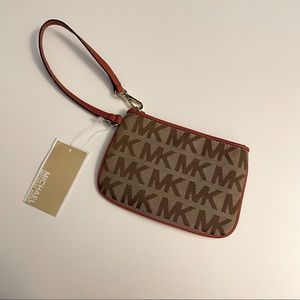 MICHAEL Michael Kors Wristlet in burnt orange
